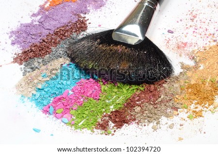 professional make-up brush on colorful crushed eyeshadow