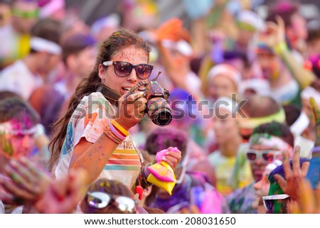 MAMAIA, CONSTANTA, ROMANIA - JULY 26: Mamaia color run 2014, in Mamaia, Constanta, on July 26, 2014. People from all walks of life participating in the fun summer run
