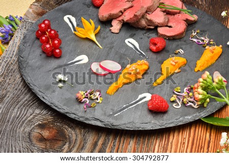 slices of duck fried meat in fancy food arrangement