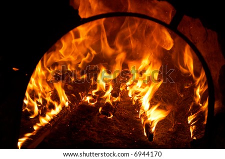 big flames from a fire burning inside an oven