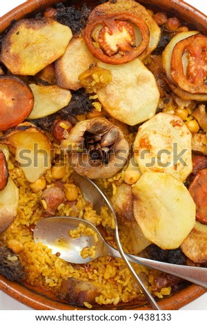 close-up of cooked spanish food with rice and vegetables