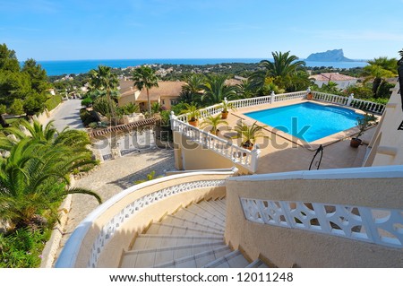 swimming pool with blue water in the yard of a luxury house