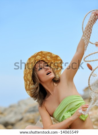 beautiful girl with hat and a fishing net