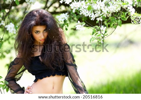 beautiful woman under blooming tree