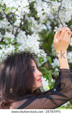 beautiful woman under blooming tree