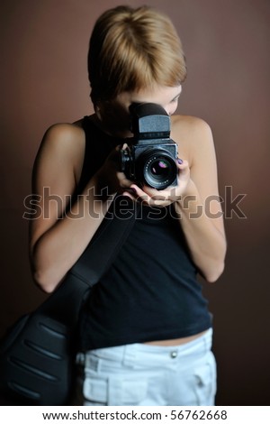 professional woman photographer in studio