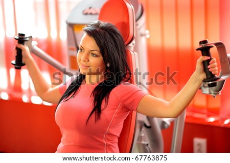 young woman exercising in the gym