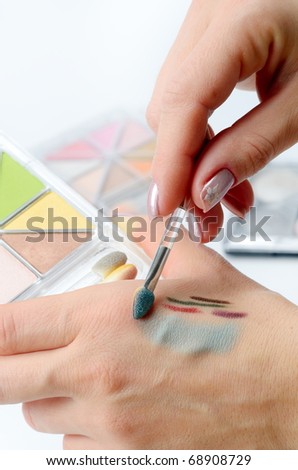 trying colorful cosmetic products