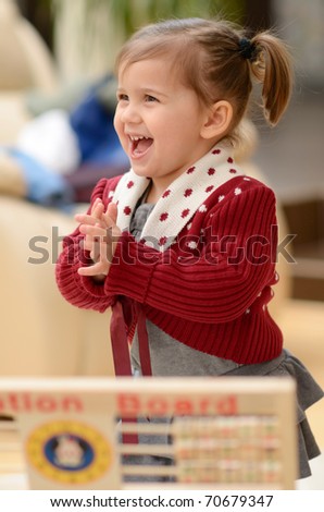 cute little girl using education board