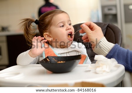 cute little girl eating cake