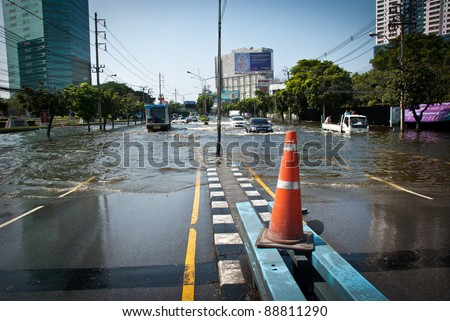 BANGKOK - NOVEMBER 7 : Large trucks carried flood victims after impact with heaviest flood and rain in 20 years in the capital on November 07, 2011 in Bangkok, Thailand.