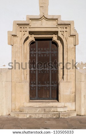 Medieval late gothic style carved and mount-ornamented front door in Szekesfehervar, Hungary