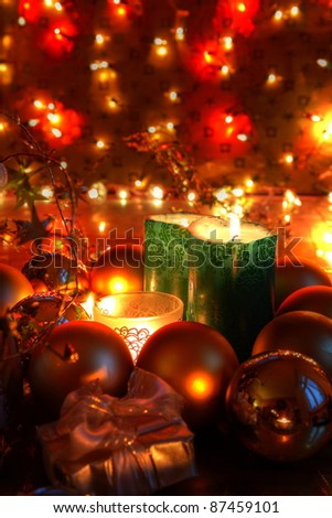 Christmas decoration with baubles,candle lights and twinkle lights on background.