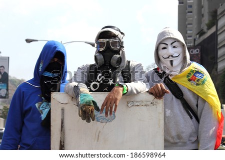 CARACAS, VENEZUELA - APRIL 10, 2014: Venezuelans protest in the street against the government for human rights violations and killings of civilians in peaceful demonstrations