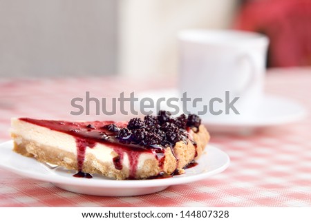 Blackberry cheesecake on table