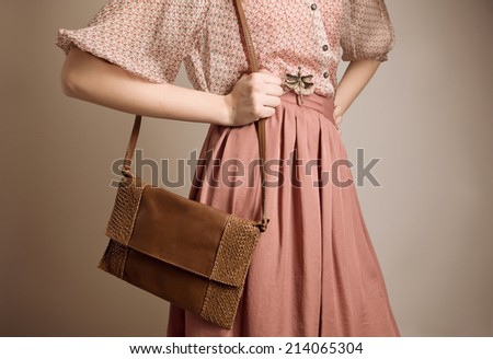 detail of fashion vintage girl with purse