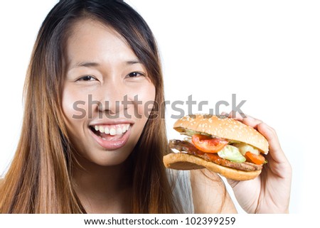 Happy asian woman  with  her hamburger on  white background