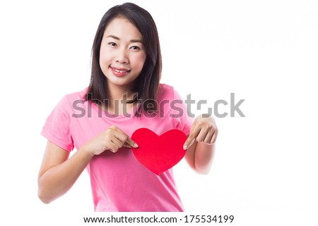Young woman holding heart on white background