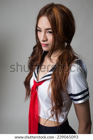 young woman in japanese anime cosplay, japanese school uniform.