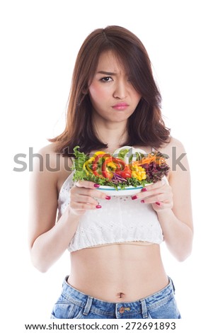 Young woman boring to eat vegetable salad, dieting concept,  on white background