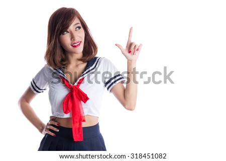 Young sexy asian woman in japanese anime cosplay, japanese school uniform, pointing to copy space, business concepts.