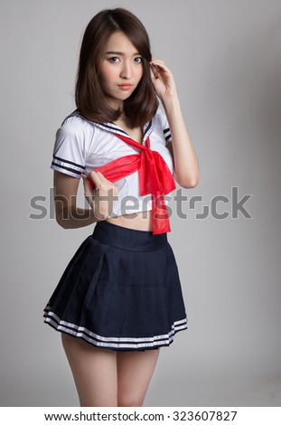 Young woman in japanese anime cosplay, japanese school uniform.