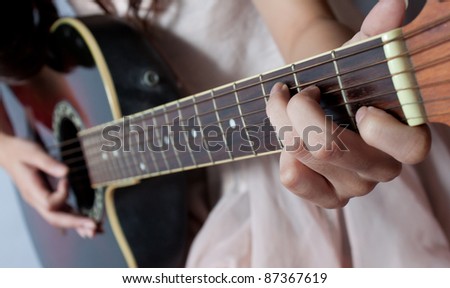 Playing on C major chord, shallow depth of field
