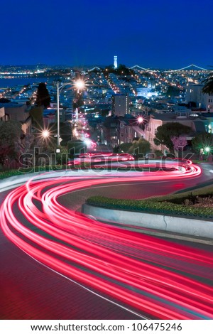 Lombard Street, one of the more famous of San Francisco, California is spiced up by some late night tourists and a long exposure.