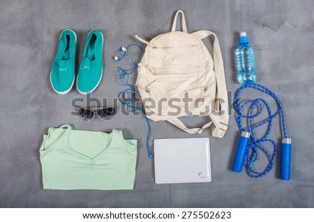 set of water sneakers backpack headphones tablet
