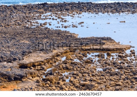 Image, Stock Photo Rocky coast among tranquil ocean water in sunny day