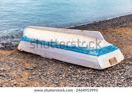 Similar – Image, Stock Photo small boats parked on the sand of a beach during sunset