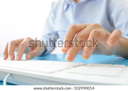 Business people typing on computer keyboard