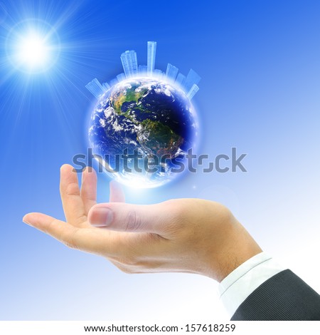 Business people holding the button with blue sky background, Earth globe image provided by NASA
