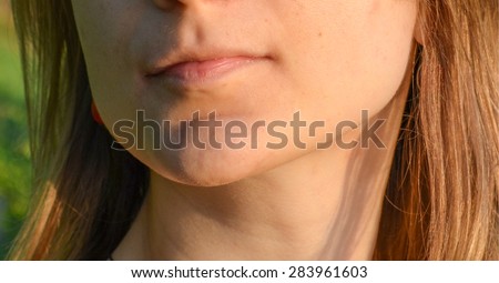 Anonymous young girl lips ready for a kiss. No cosmetics, summer walk and love