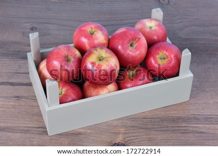 fresh gala apple in crate on table