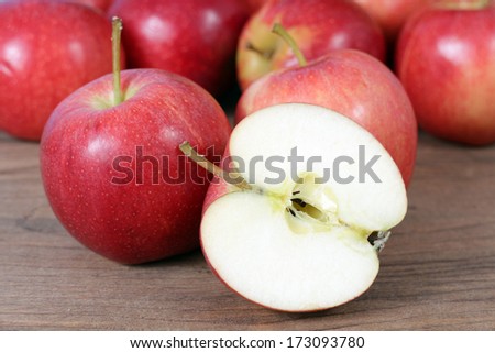 full and half gala apple on the table