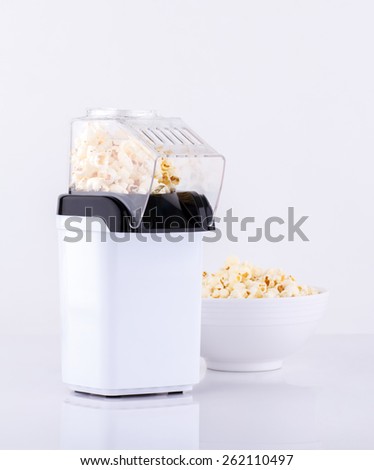 Popcorn making machine isolated on white background