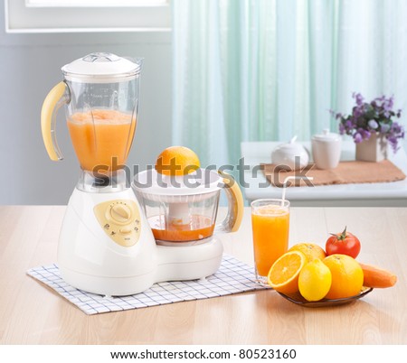 Orange juice blender machine in the kitchen interior