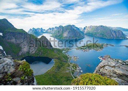 Similar – Image, Stock Photo A fjord in Norway. In the foreground the sea and in the background snow-covered mountain tops. The blue sky is decorated by veil clouds.