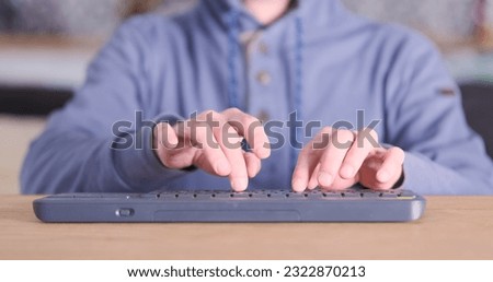 Similar – Image, Stock Photo Anonymous male writer typing on old fashioned typewriter