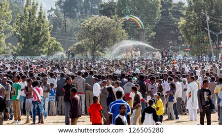 ADDIS ABABA, ETHIOPIA - JANUARY 19: Holy water sprayed on thousands of people attending Timket celebrations of Epiphany, commemorating the baptism of Jesus, on January 19, 2013 in Addis Ababa, Ethiopia.