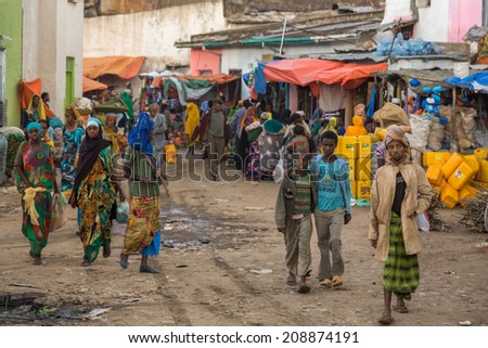 HARAR, ETHIOPIA - JULY 26,2014 - Local residents of Jugol, the fortified historic walled city in the UNESCO World Heritage List considered as the fourth holy city of Islam.