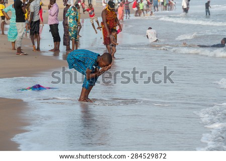 Cotonou, Benin - May 25: Local residents of Cotonou enjoy their Monday afternoon at Obama Beach on May 25, 2015 in Cotonou, Benin.