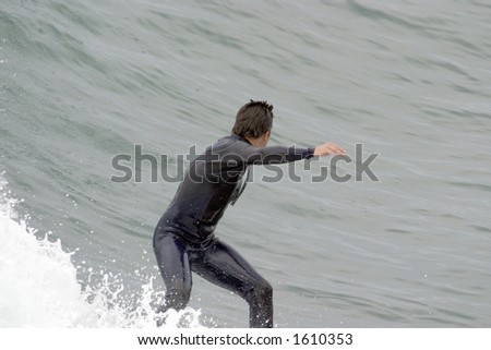 Surfer cutting back into forming wave