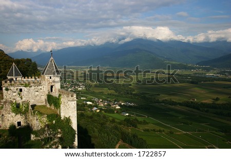 French castle above a plain in Haute-Savoie, France.