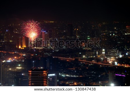BANGKOK THAILAND - DECEMBER 30 : Firework of New year celebrations taking place at Chao Phraya river on December 30,2012 in Bangkok, Thailand.