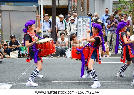 TOKYO, JAPAN - JULY 27: Dance show at Shinjuku Eisa Festival on July 27 2013. 26 eisa dance troupes take to the streets around the east exit of Shinjuku Station to beat portable taiko drums.