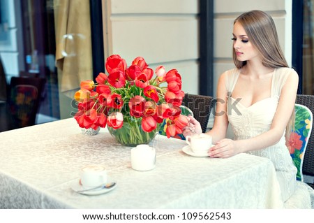 beautiful girl is waiting for him in the coffee