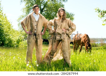 Ancient Medieval couple in original costumes from gunny sacking
