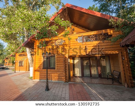Holiday apartment - wooden cottage in summer forest